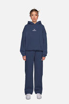 Blue women's hoodie with hood, long sleeves and chest logo