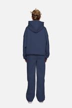 Blue women's hoodie with hood, long sleeves and chest logo