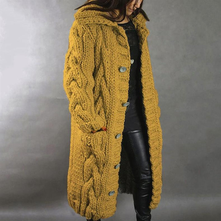 Women's long cable knit hooded coat with button fastening