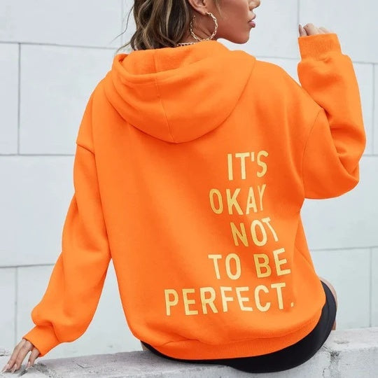 Women's oversized hooded sweatshirt with contrasting text graphic on the back