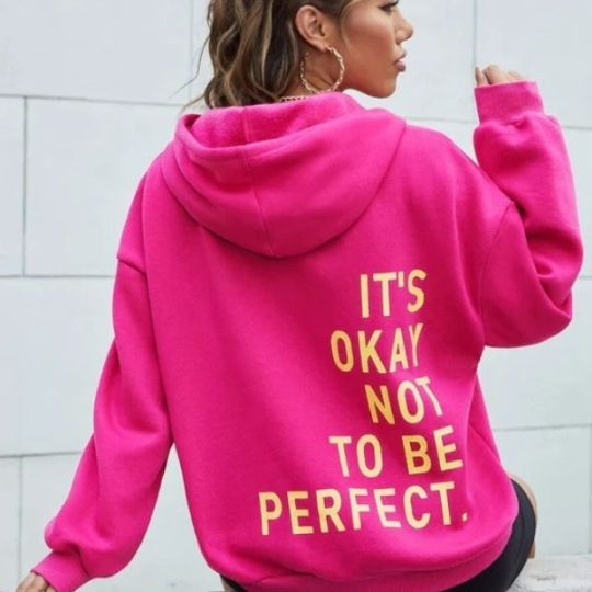 Women's oversized hooded sweatshirt with contrasting text graphic on the back