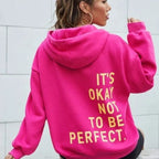Women's oversized hooded sweatshirt with contrasting text graphic on the back