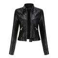 Women's fitted faux leather biker jacket with stand collar, long sleeves and zipped pockets