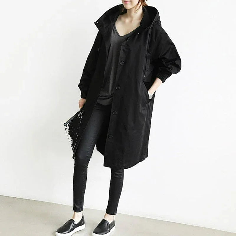 Women's hooded trench coat with button front and angled pockets