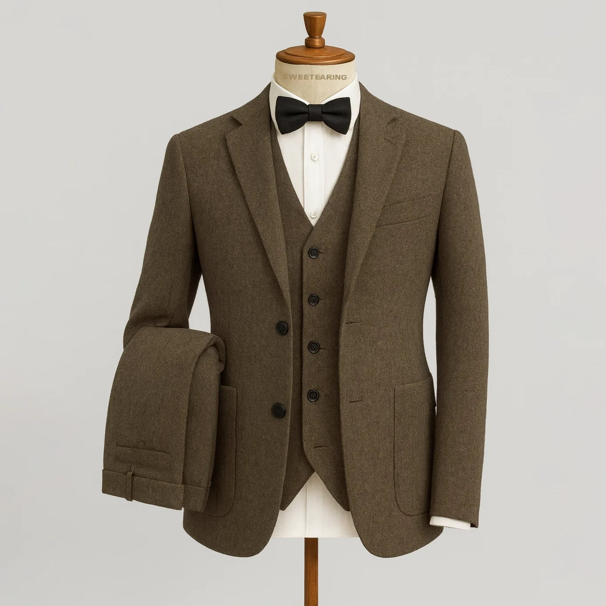 Men's three-piece textured suit with notched jacket, buttoned waistcoat and tailored trousers