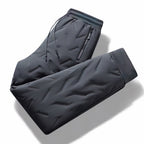 Women's quilted jogger trousers with drawstring waist, zipped pockets and ribbed ankle cuffs