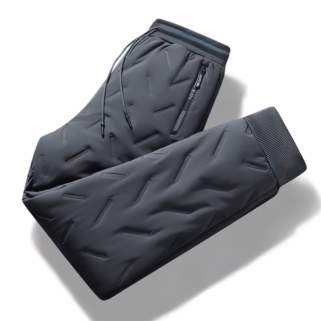 Women's quilted jogger trousers with drawstring waist, zipped pockets and ribbed ankle cuffs