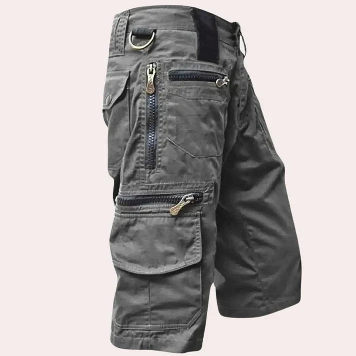 Men's cargo shorts with multiple utility pockets and zip fastenings