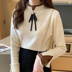Women's mock neck sweater with long sleeves, ribbed trims and ribbon neckline detail