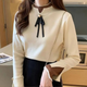 Women's mock neck sweater with long sleeves, ribbed trims and ribbon neckline detail