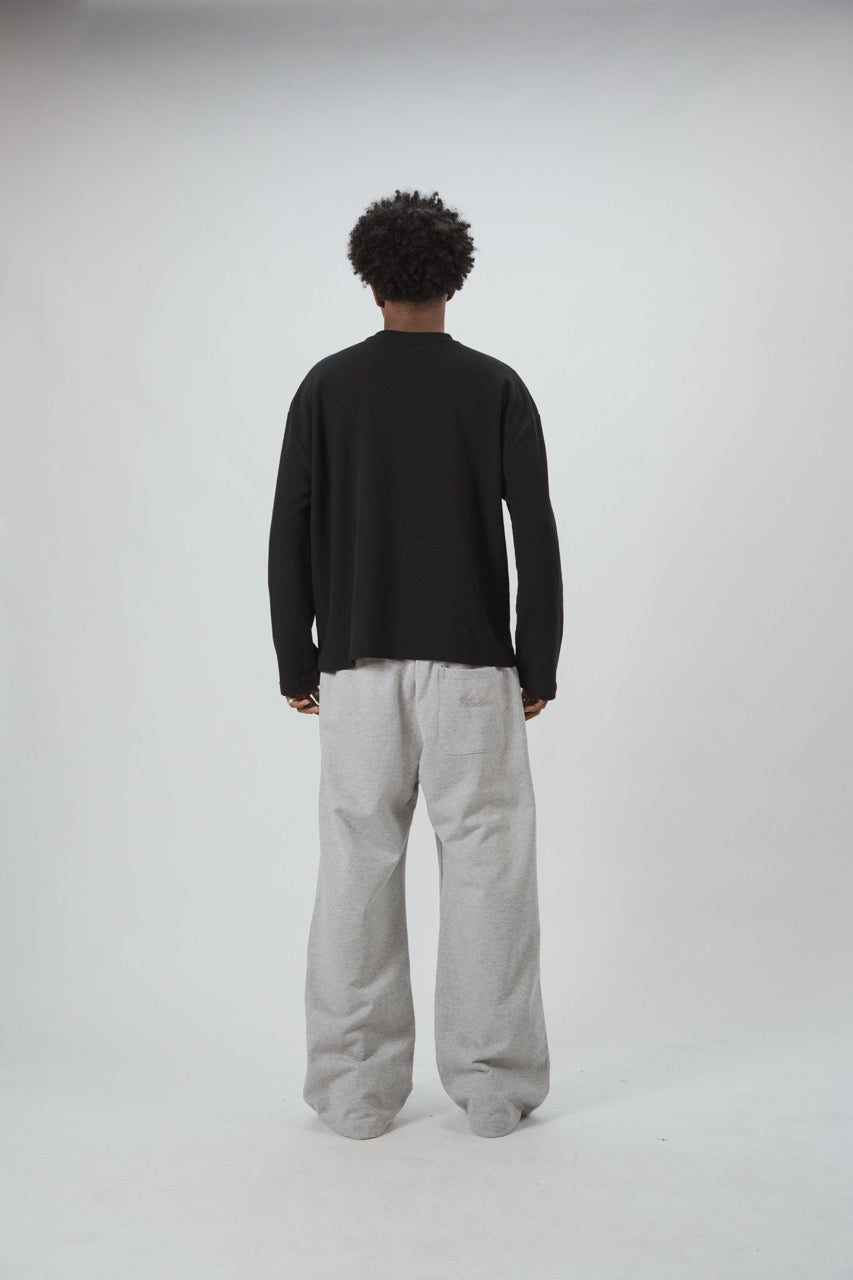 Black men's waffle sweatshirt with vertical script graphic