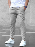Men's slim fit jogger pants with drawstring waist and tapered cuff in grey
