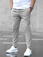 Men's slim fit jogger pants with drawstring waist and tapered cuff in grey