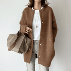 Women's longline button front cardigan with round neckline and long sleeves