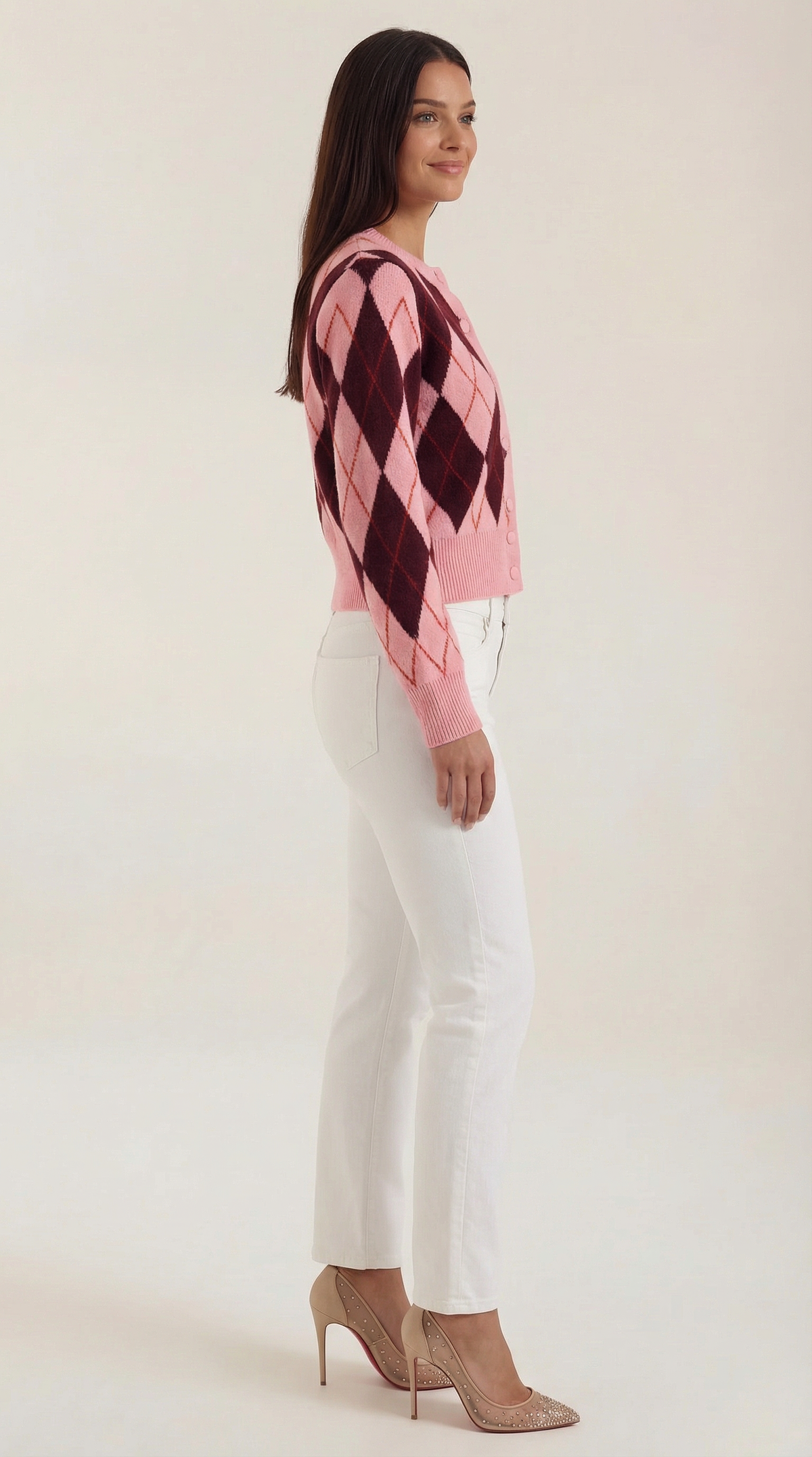 Women's pink argyle cardigan with long sleeves and button front