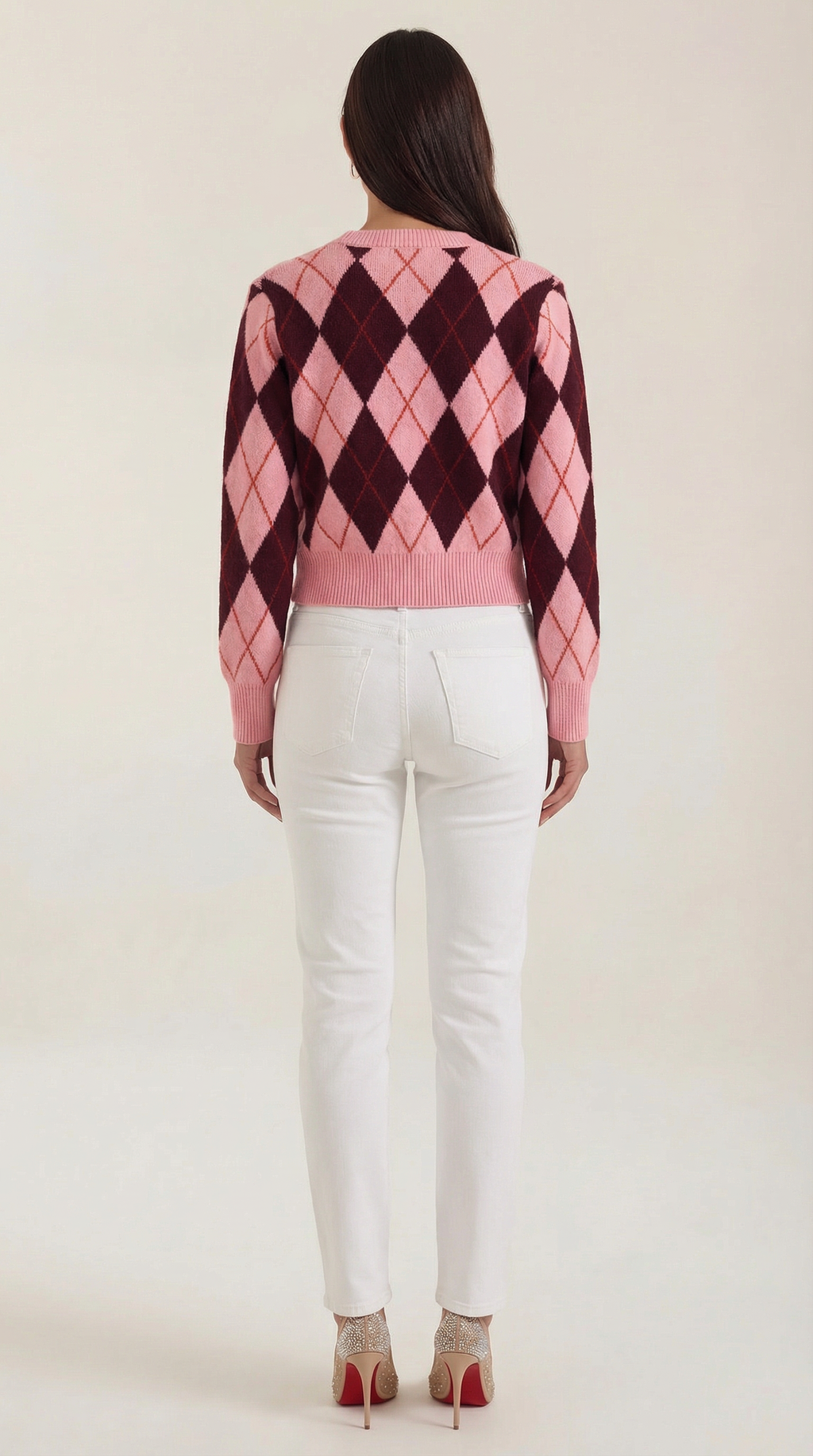 Women's pink argyle cardigan with long sleeves and button front