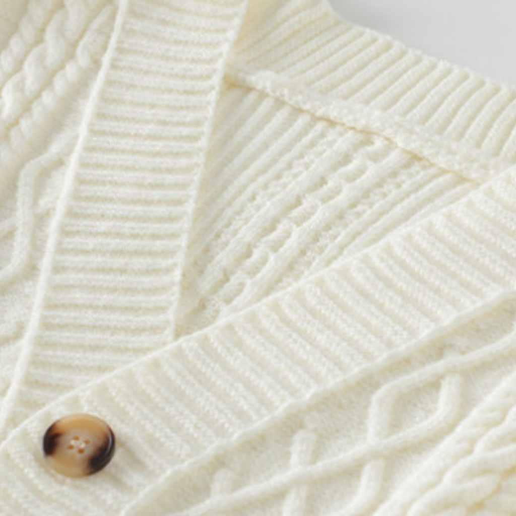 Braided knit cardigan with geometric bands, buttons and patch pockets