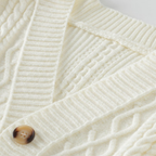Braided knit cardigan with geometric bands, buttons and patch pockets