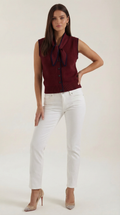 Women's sleeveless knitted cardigan with tie collar and button front
