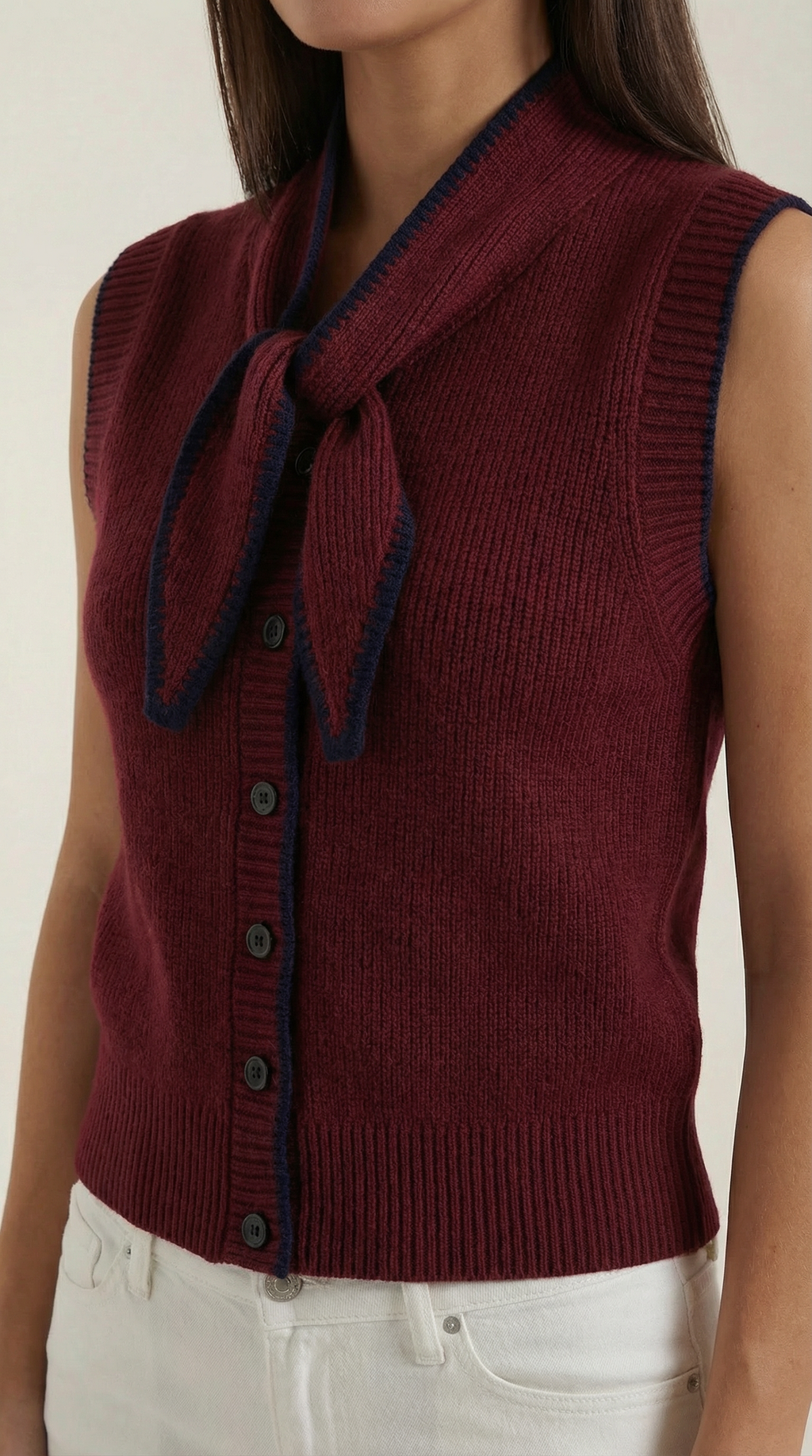 Women's sleeveless knitted cardigan with tie collar and button front