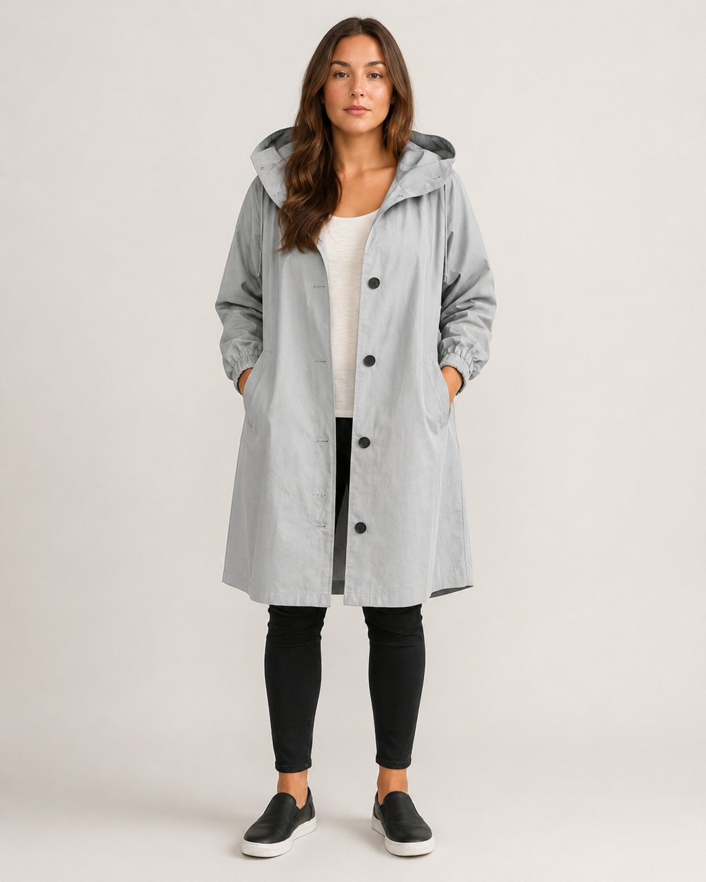 Women's hooded mid-length rain coat with button front and side pockets