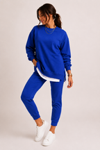 Women's crew neck sweatshirt and jogger set with side slits and cuffed trousers