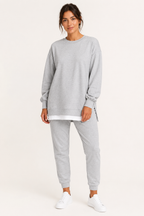 Women's crew neck sweatshirt and jogger set with side slits and cuffed trousers