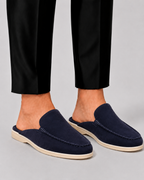 Men's open-heel loafer mules with stitched trim and flat soles