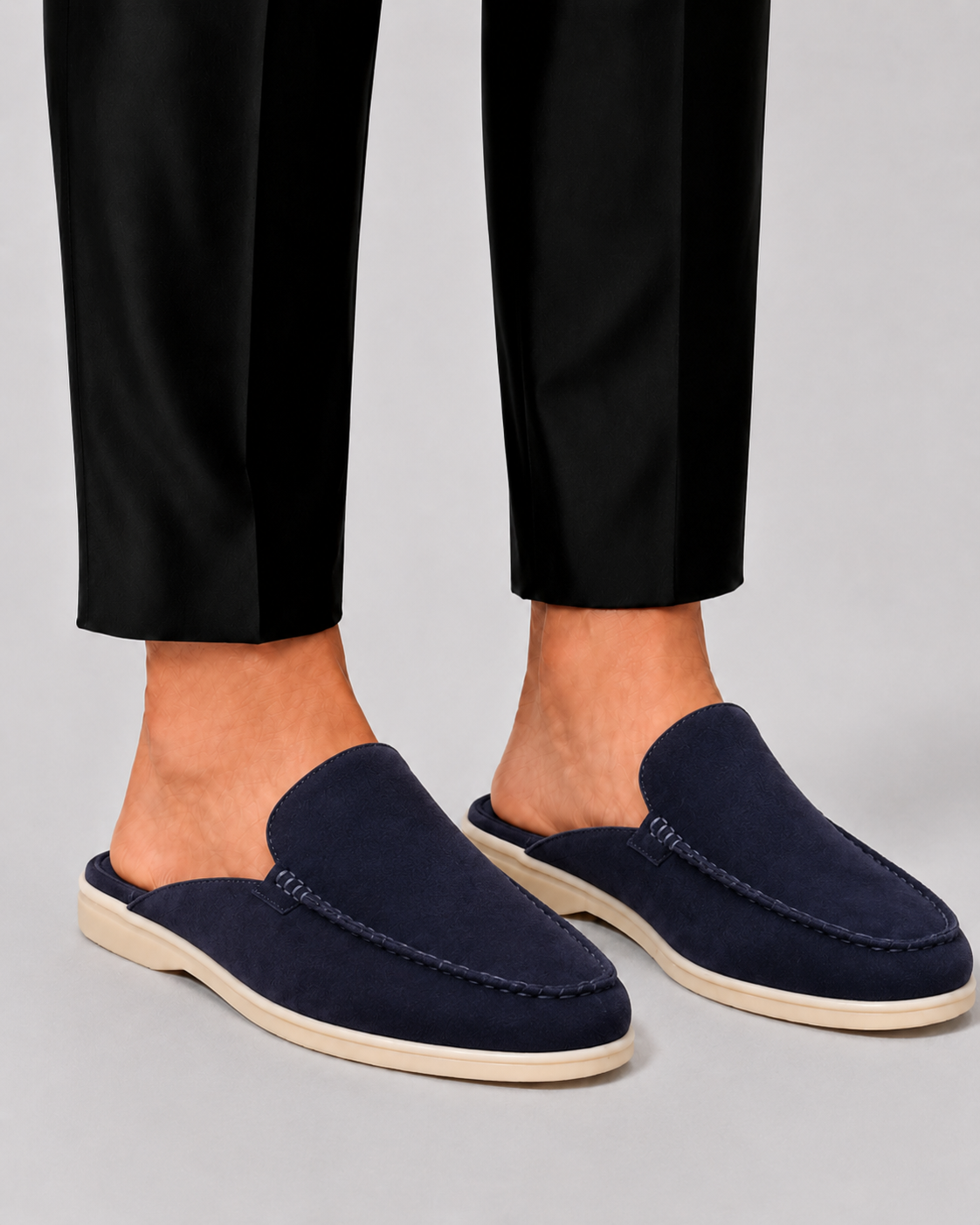 Men's open-heel loafer mules with stitched trim and flat soles