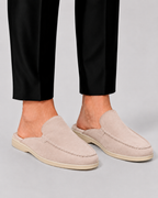 Men's open-heel loafer mules with stitched trim and flat soles