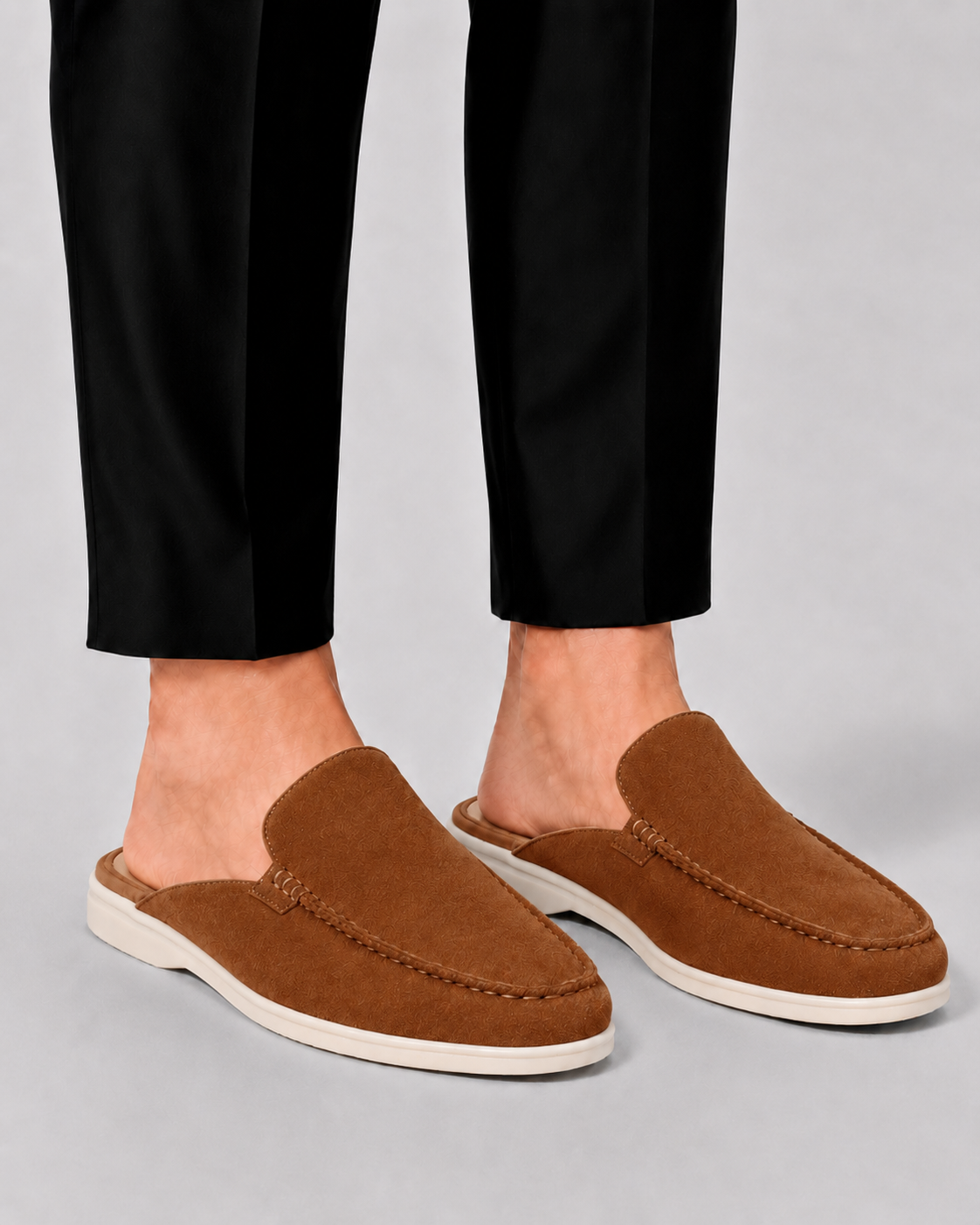 Men's open-heel loafer mules with stitched trim and flat soles