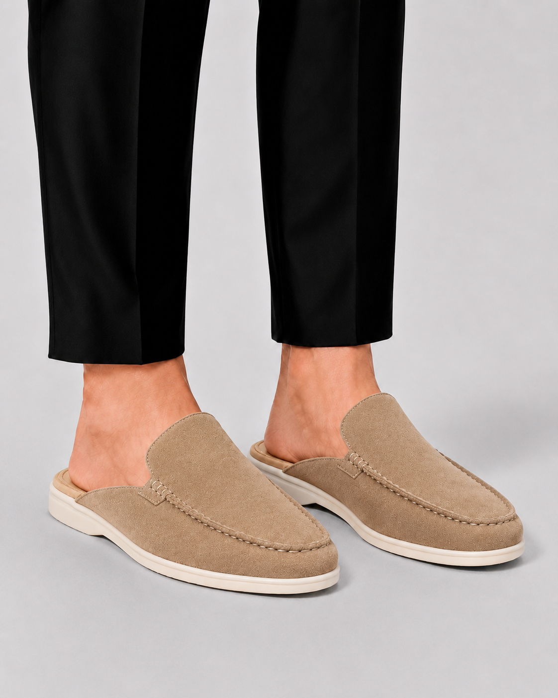 Men's open-heel loafer mules with stitched trim and flat soles