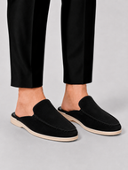 Men's open-heel loafer mules with stitched trim and flat soles