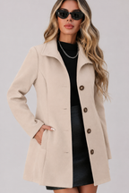 Women's button front trench coat with long sleeves and structured shaping