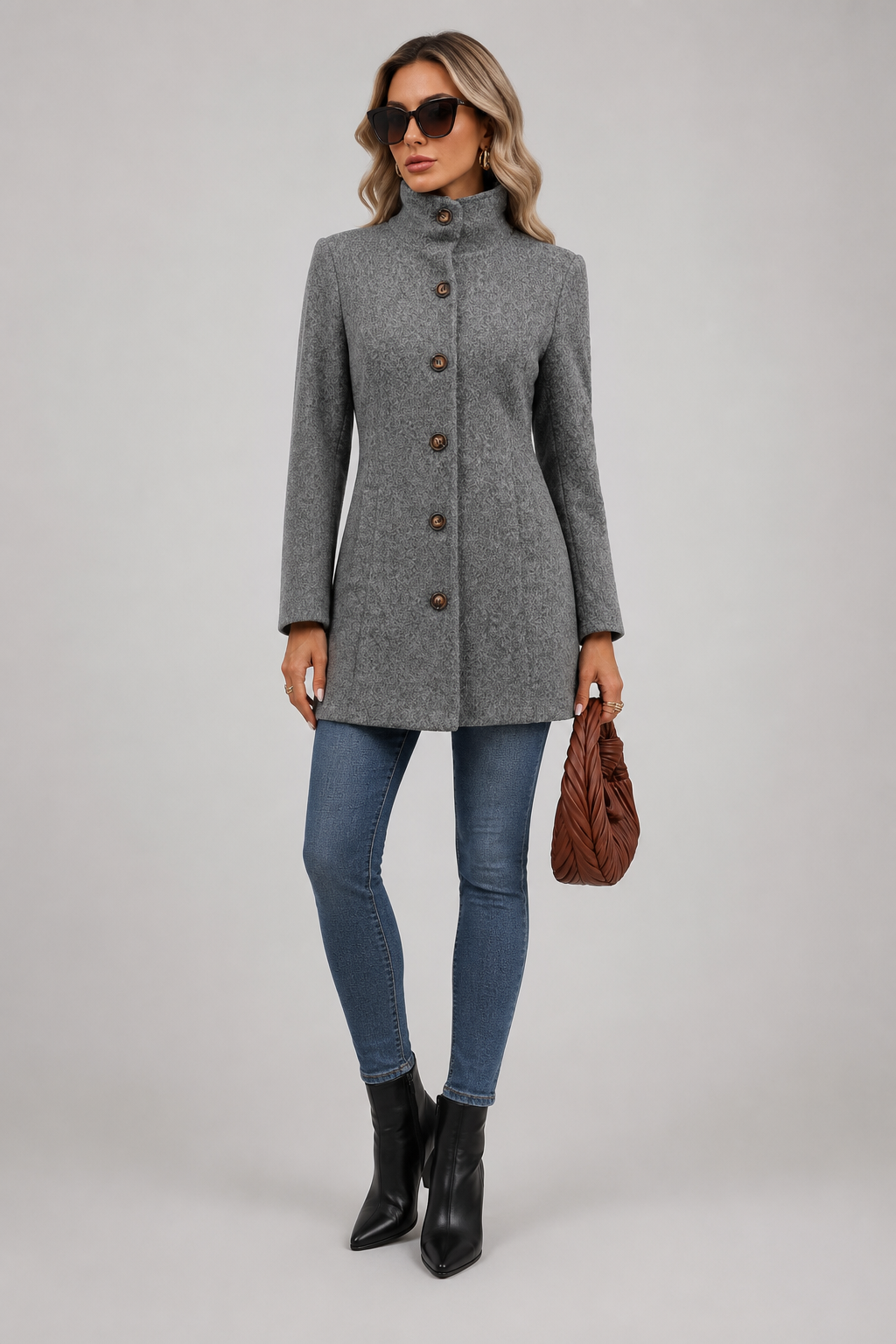 Women's button front trench coat with long sleeves and structured shaping