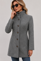 Women's button front trench coat with long sleeves and structured shaping
