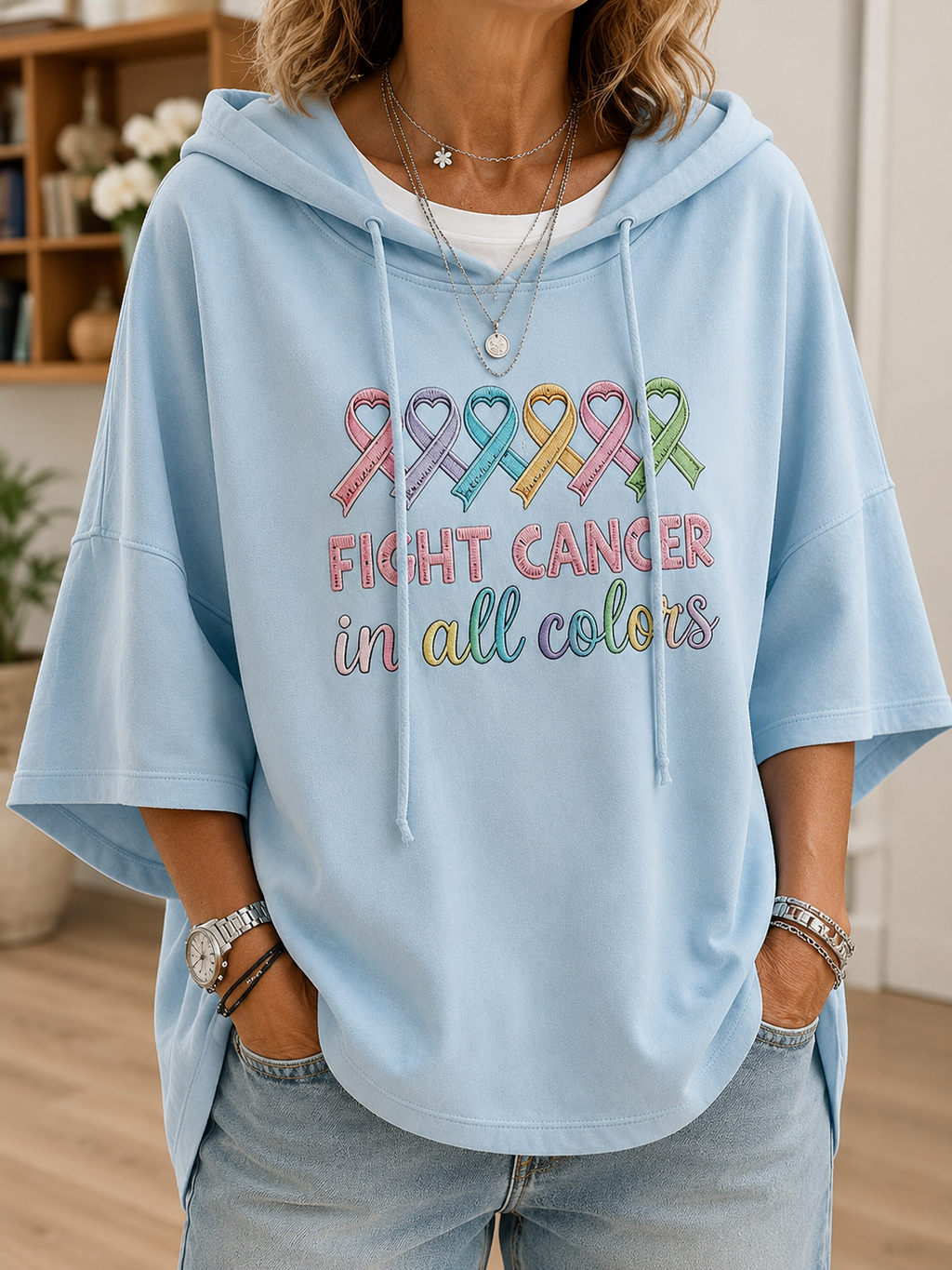 Women's short-sleeve hooded top with colourful awareness ribbon graphic