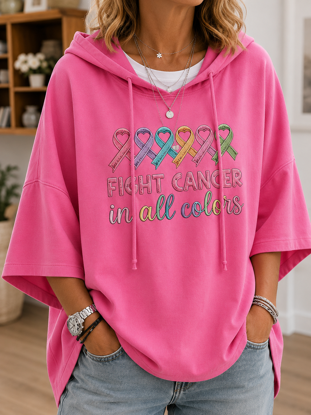 Women's short-sleeve hooded top with colourful awareness ribbon graphic