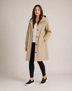 Women's hooded mid-length rain coat with button front and side pockets