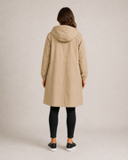 Women's hooded mid-length rain coat with button front and side pockets