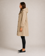 Women's hooded mid-length rain coat with button front and side pockets