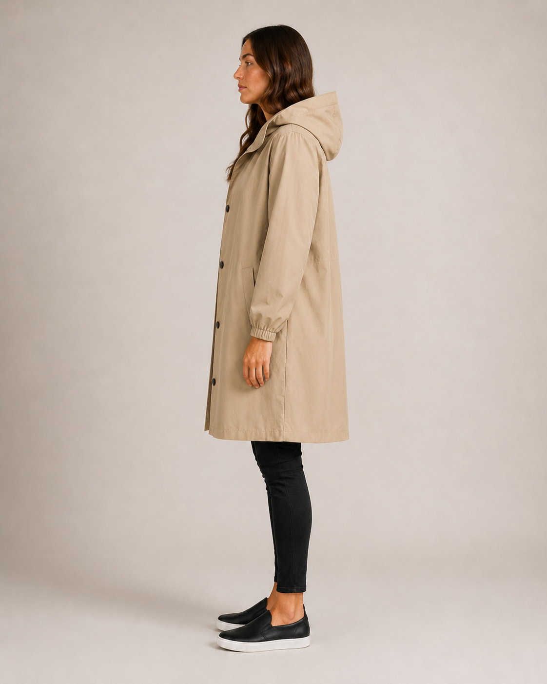 Women's hooded mid-length rain coat with button front and side pockets