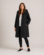 Women's hooded mid-length rain coat with button front and side pockets