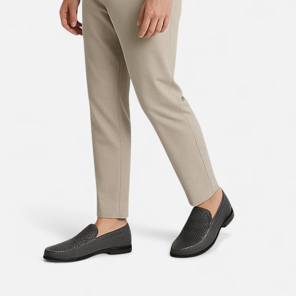 Men's perforated brown moc toe slip-on loafer with low heel