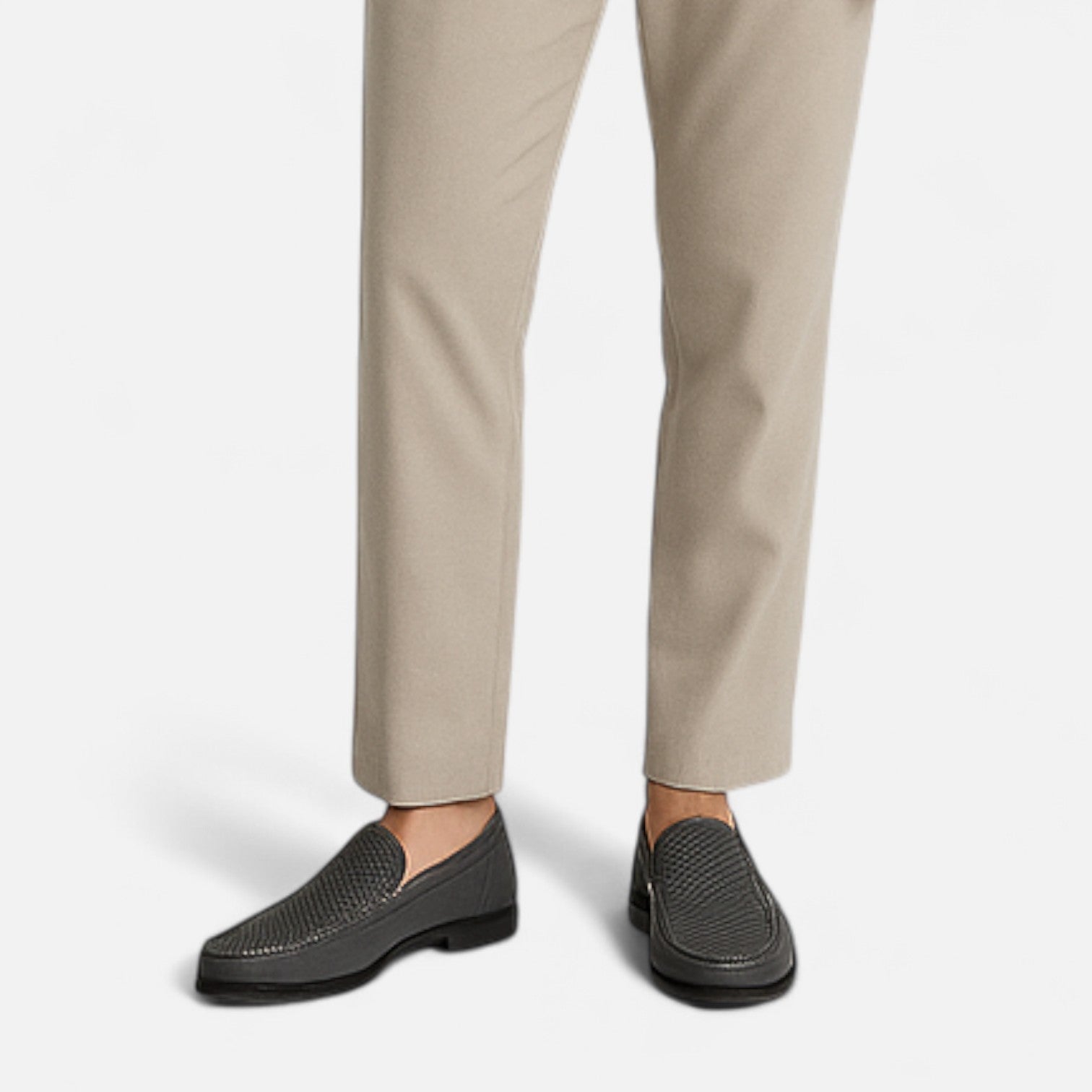 Men's perforated brown moc toe slip-on loafer with low heel