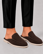 Men's open-heel loafer mules with stitched trim and flat soles