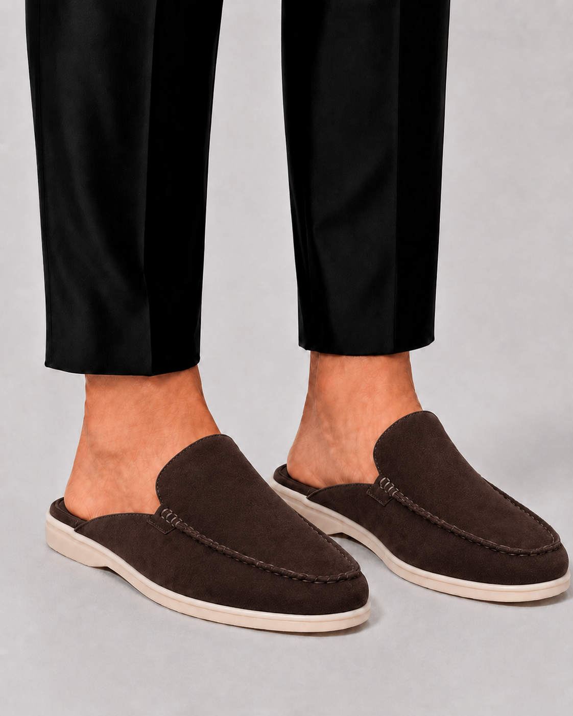 Men's open-heel loafer mules with stitched trim and flat soles