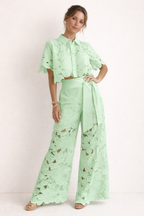 Women's floral lace co ord set with cropped collared blouse and wide leg trousers