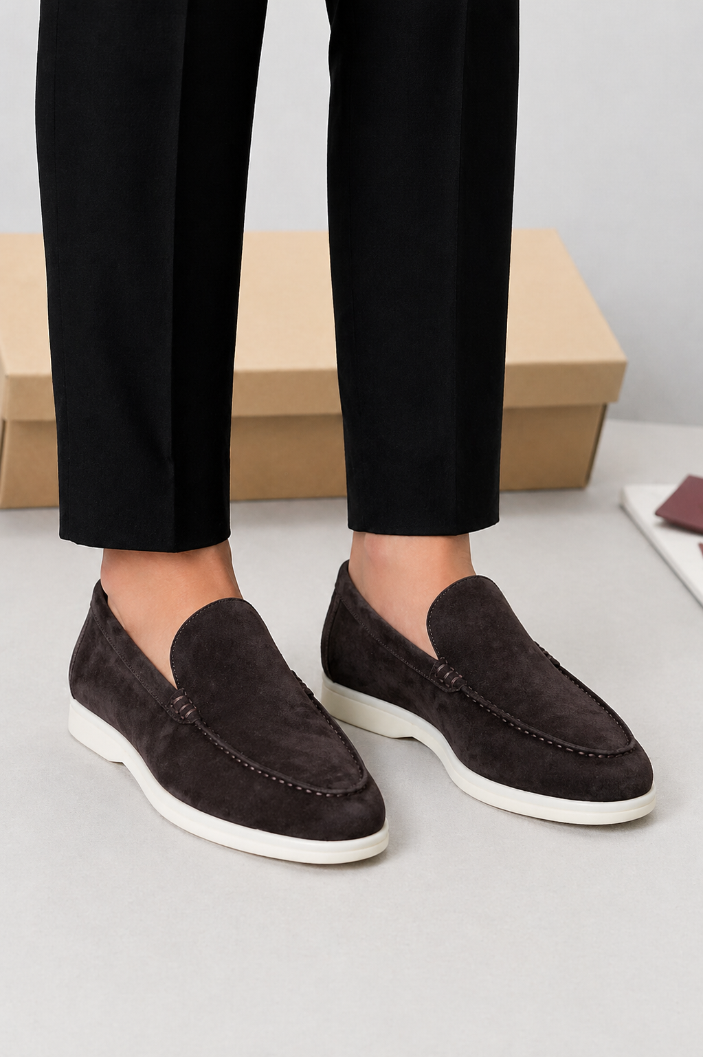 Men's slip-on loafers with moc toe stitching and low white soles