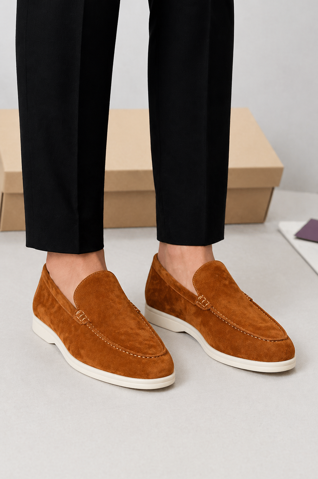 Men's slip-on loafers with moc toe stitching and low white soles